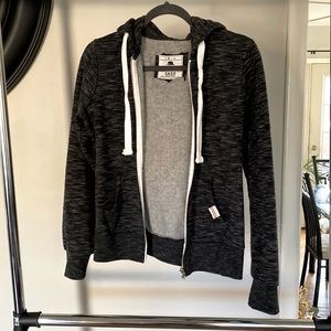 Zip front hooded sweatshirt.